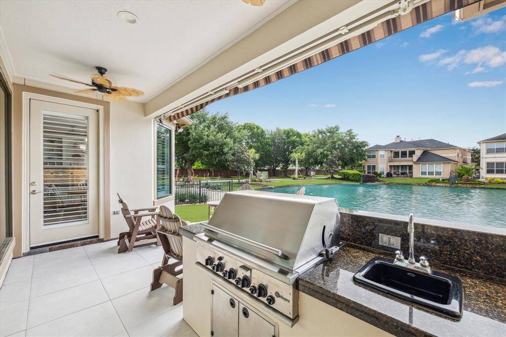 Enjoy grilling out with the built-in outdoor kitchen, all while taking in the beautiful lake views. Grill features cast iron burners.