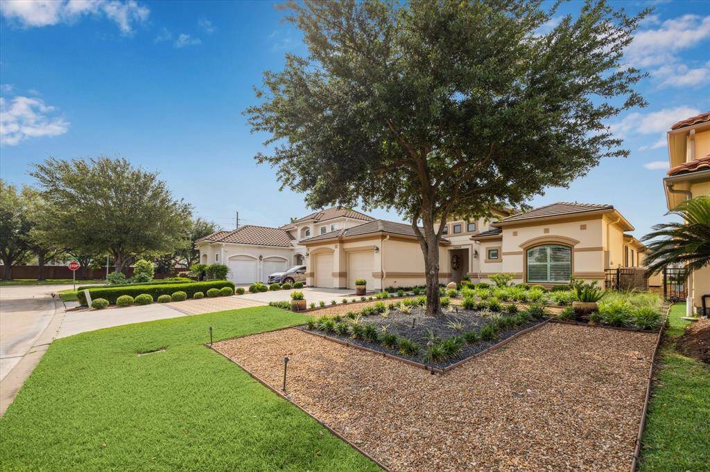 Here’s another look at the home’s inviting front exterior—one of the few distinguished single-story residences in this sought-after neighborhood.