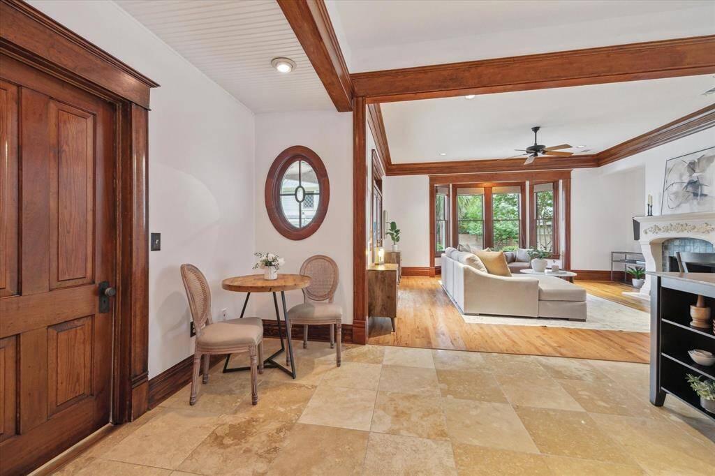 A charming breakfast nook sits just off the kitchen, with the laundry room conveniently tucked behind the solid wood door.