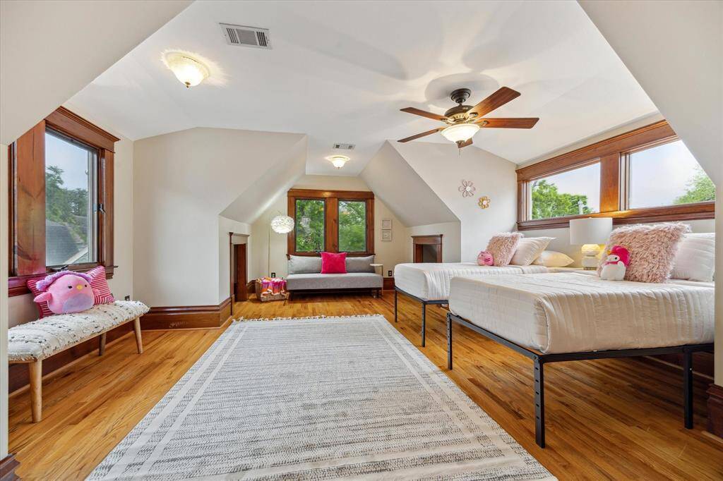 With treetop views, natural light and warm hardwood floors, this upstairs bedroom as a storybook feel - ideal for rest, play or a creative retreat.