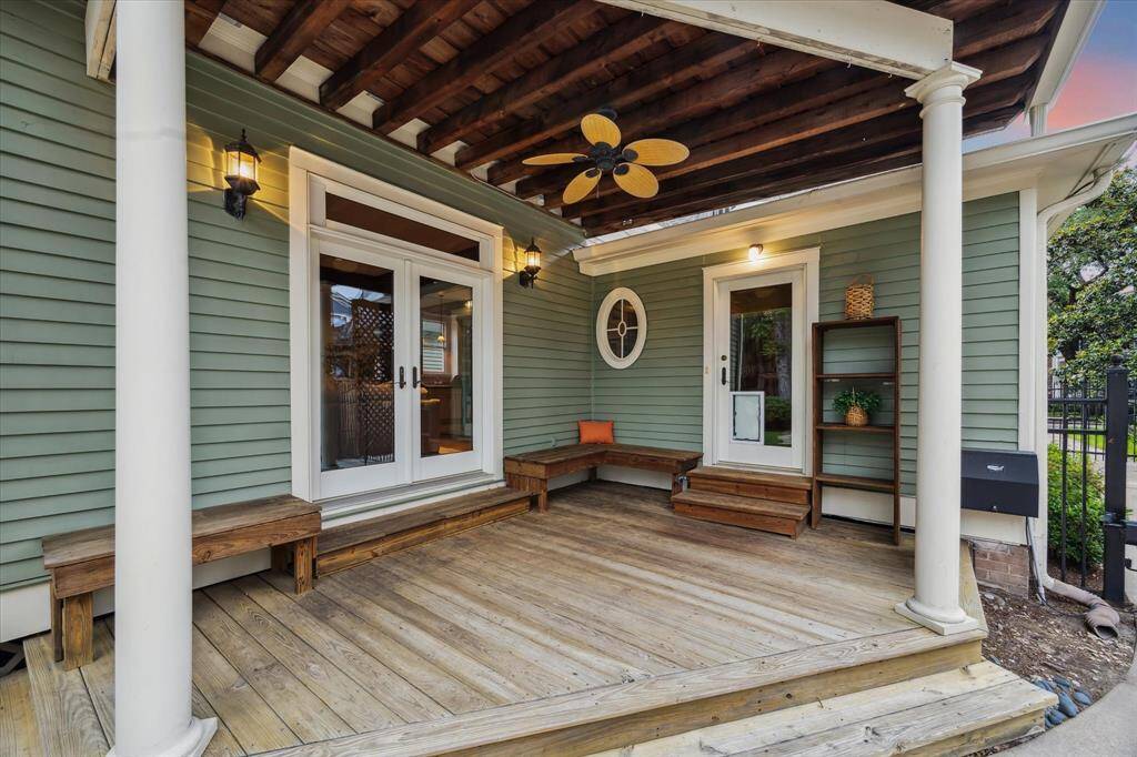 This covered porch features built in seating and easy access to the family room and laundry room.