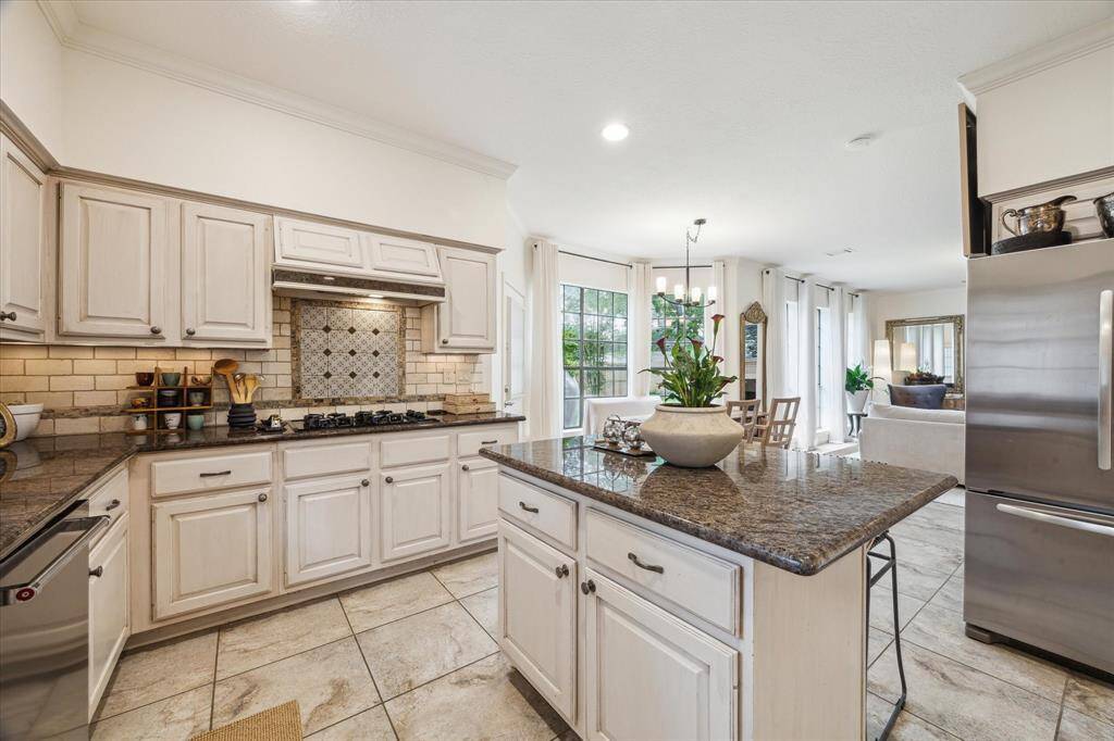 Open kitchen with recessed lighting and oversize pantry