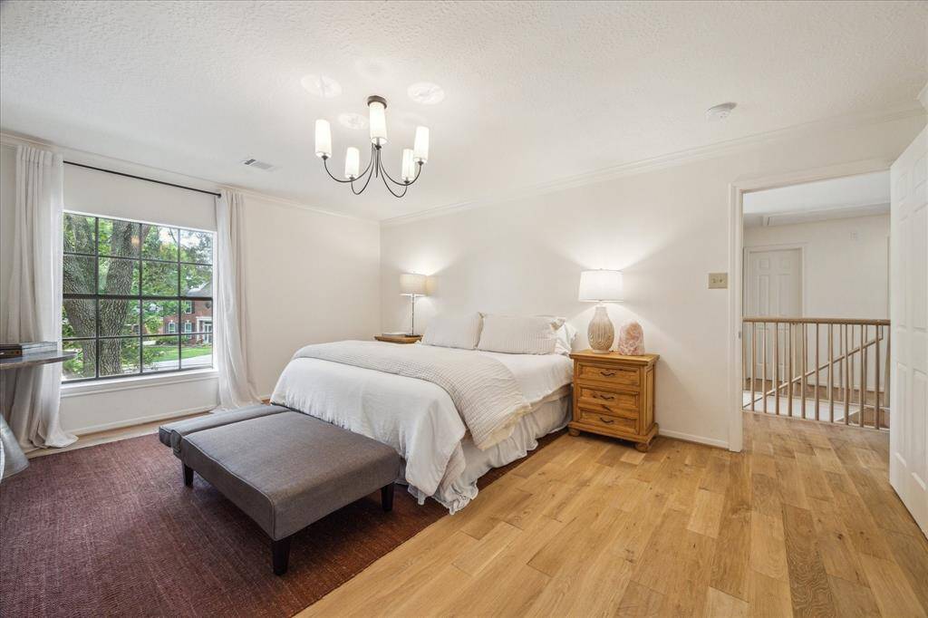 Primary suite has hardwood floors