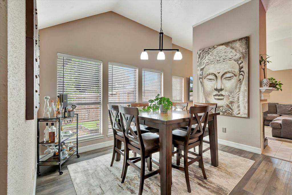 Dining and living rooms are separated by fireplace wall.
