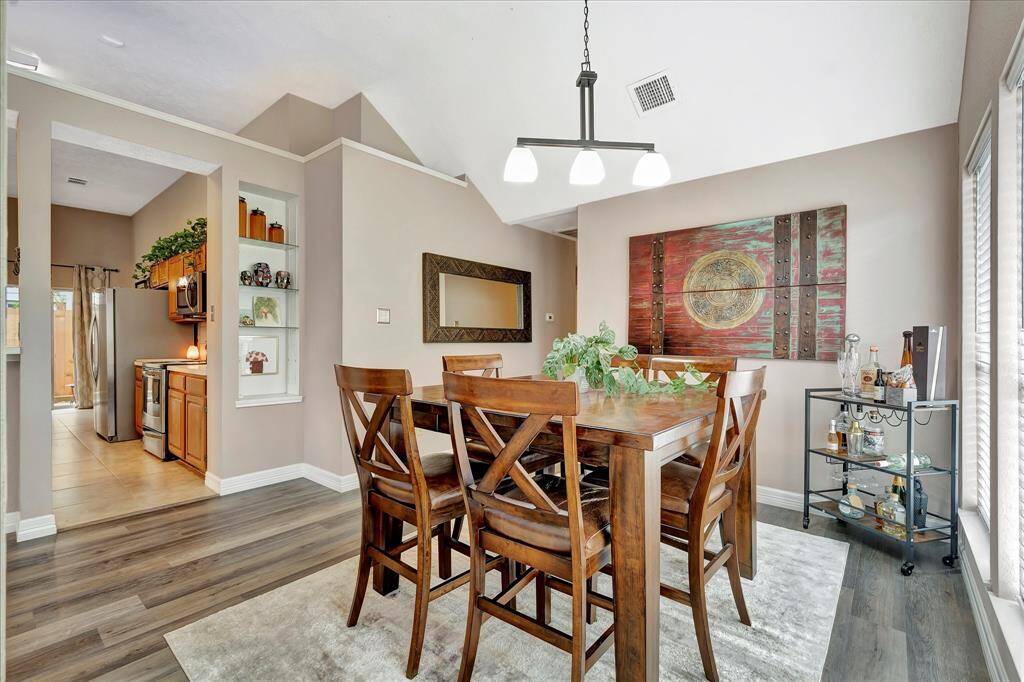 Easy access to kitchen. Built-in display shelves.