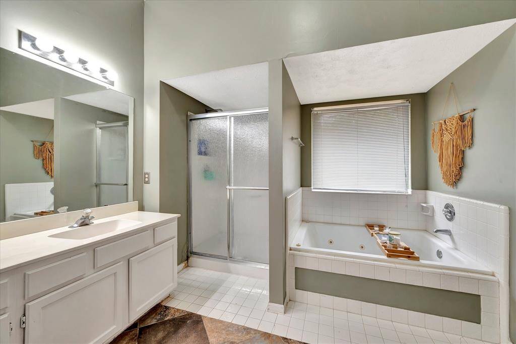 Jetted tub and walk-in shower.