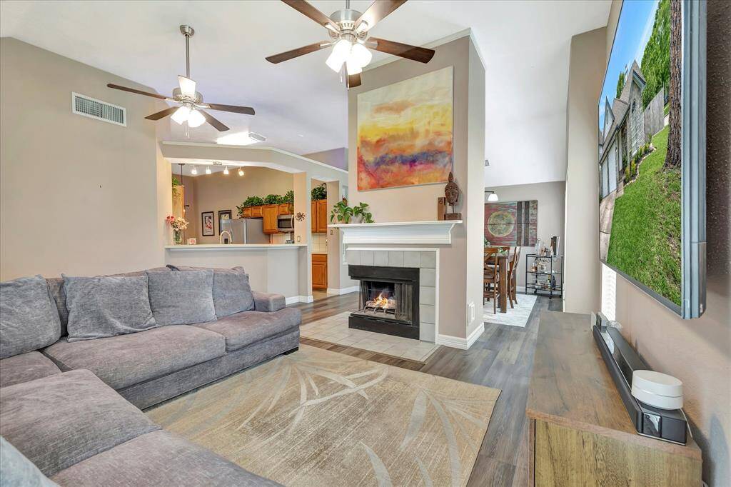 Gas log fireplace showcased in the center!