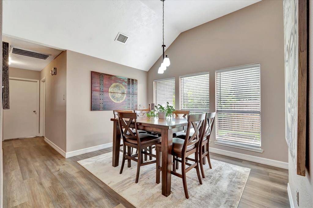 Dining area with a wall of windows.