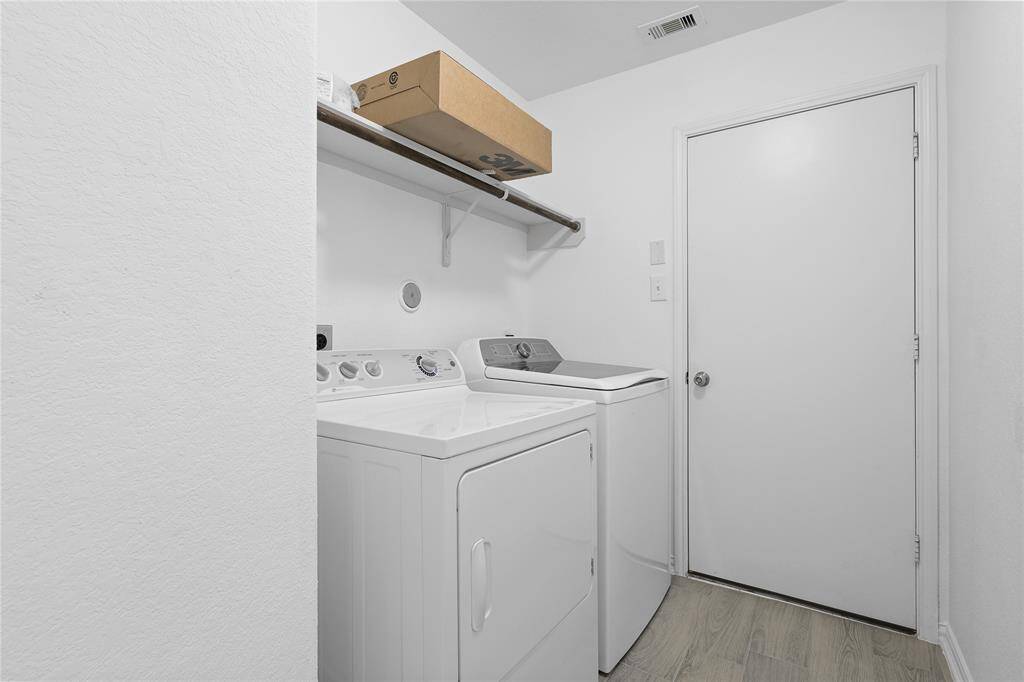 Primary Ensuite view of vanity and walk-in closet.