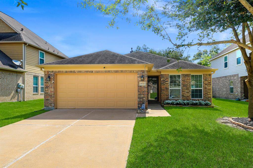 Discover your perfect retreat in this inviting home featuring a spacious lawn, charming trees, and spacious driveway for ample parking. Ideal for family living.