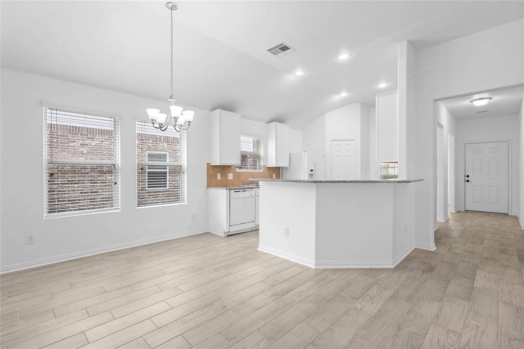 Spacious family room and dining area. Virtually Staged to showcase versatile furniture layout. arrangements.