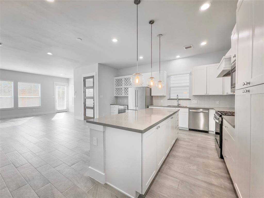 Open concept kitchen over looking into the living room