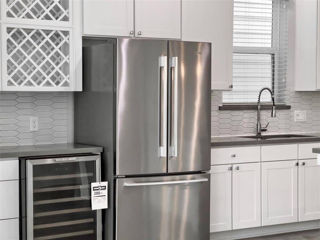 Stainless steel appliances with a beverage fridge - all appliances come with the home.