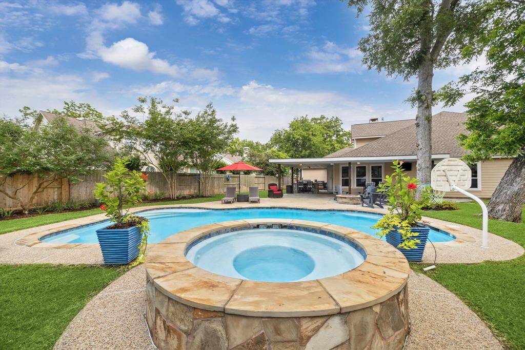 PRIVATE BACKYARD OASIS INCLUDES A SPARKLING POOL AND SPA WITH UPDATED PLASTER, FILTERS, AND ELECTRIC CLEANER—IDEAL FOR RELAXING AND ENTERTAINING.