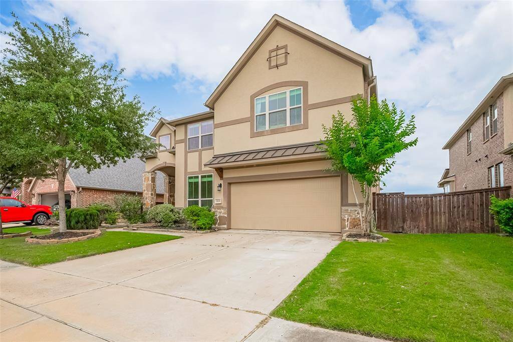 Another view of this modern home with a welcoming curb appeal.