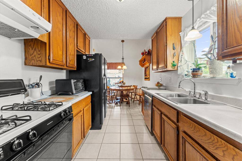 Light and Bright kitchen with plenty of cabinet space and a window above your sink!