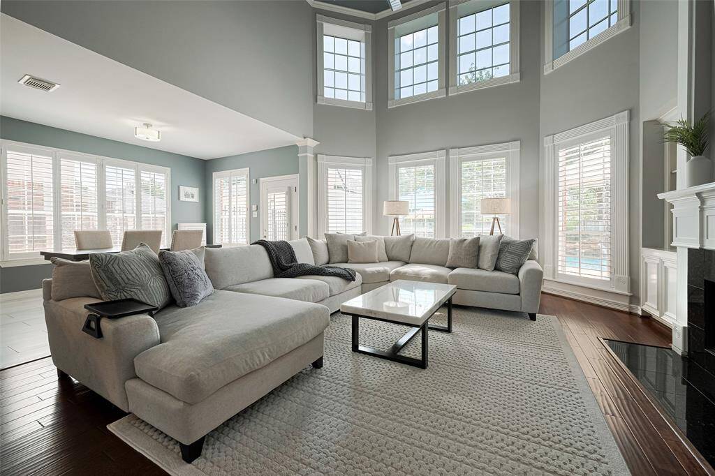 Notice the top windows are framed with trim for a custom built look?