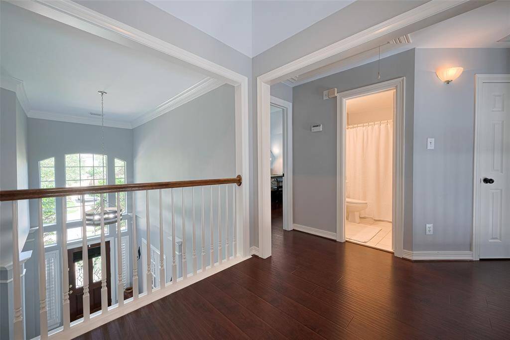 The lovely upstairs landing is spacious and offers wonderful views of the entryway and the living room.  It features 2 bedrooms with a Jack& Jill bath on one side and two bedrooms with a separate bath on the other side.