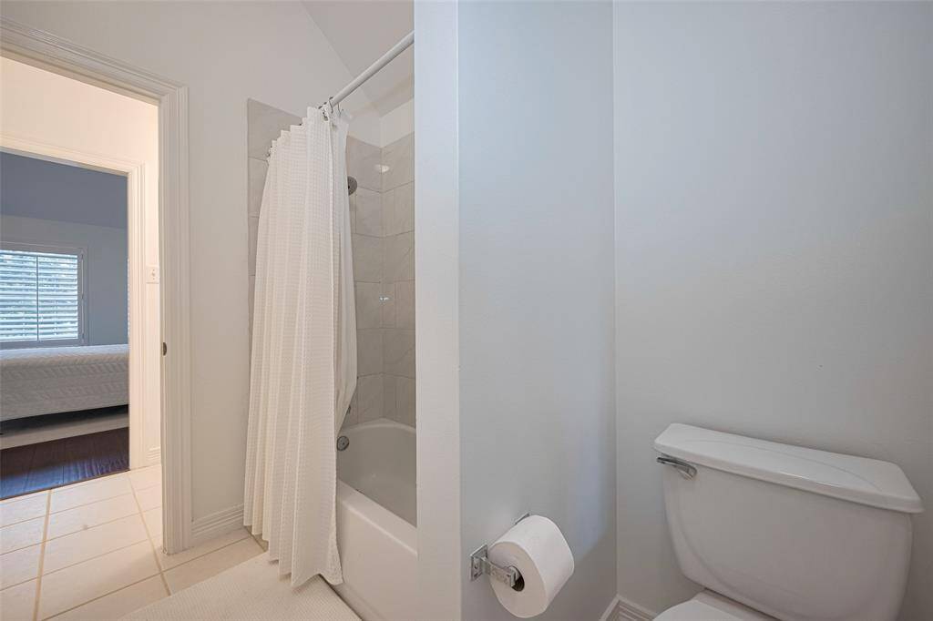 The Jack & Jill bathroom upstairs features fresh paint, a shower/tub combo and tile floors.