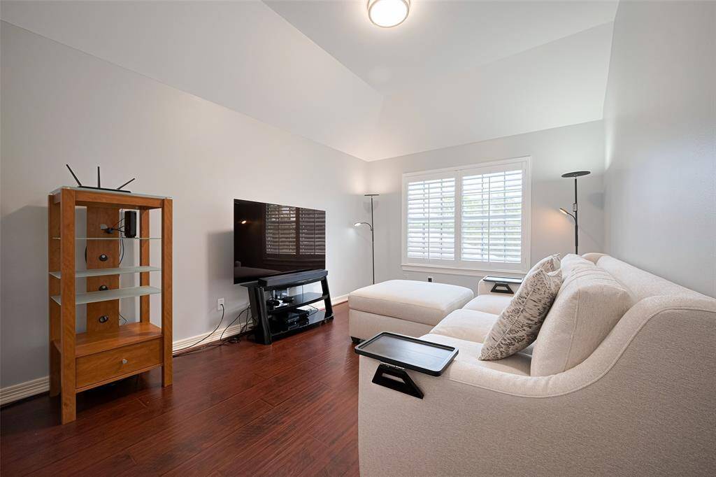 The fourth bedroom upstairs is the smalles but still quite spacious.  It features fresh paint, window shutters, wood-look laminate floors and a large closet.