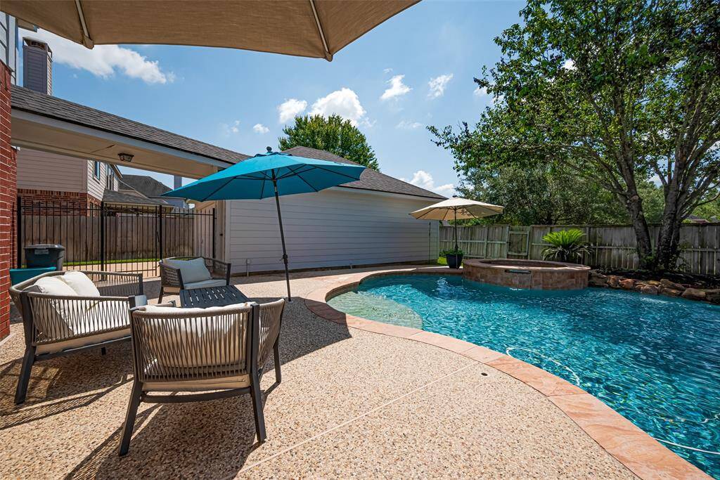 Enjoy your coffee in the morning or a cocktail in the evening in this gorgeous backyard.