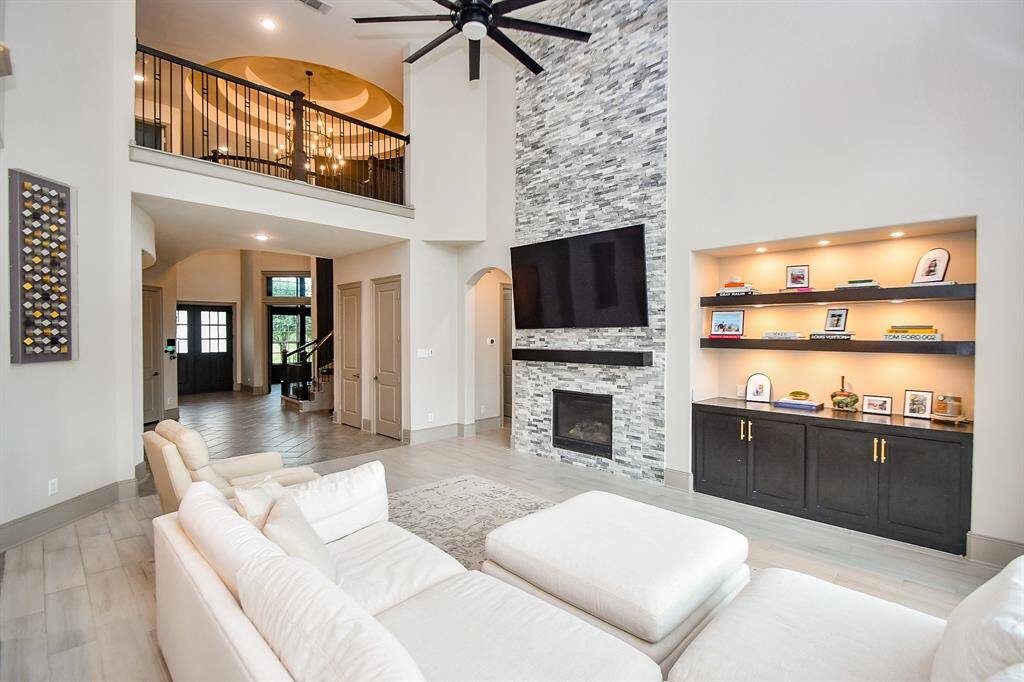 High ceilings, fireplace with mantel! Enjoy the builtins and floating shelves for an elegant touch!