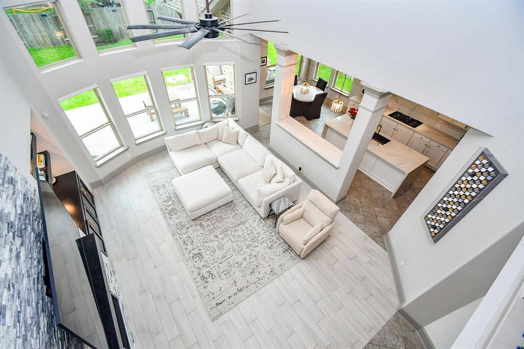 Windows galore! Look down from second story at this open, magnificent living room!