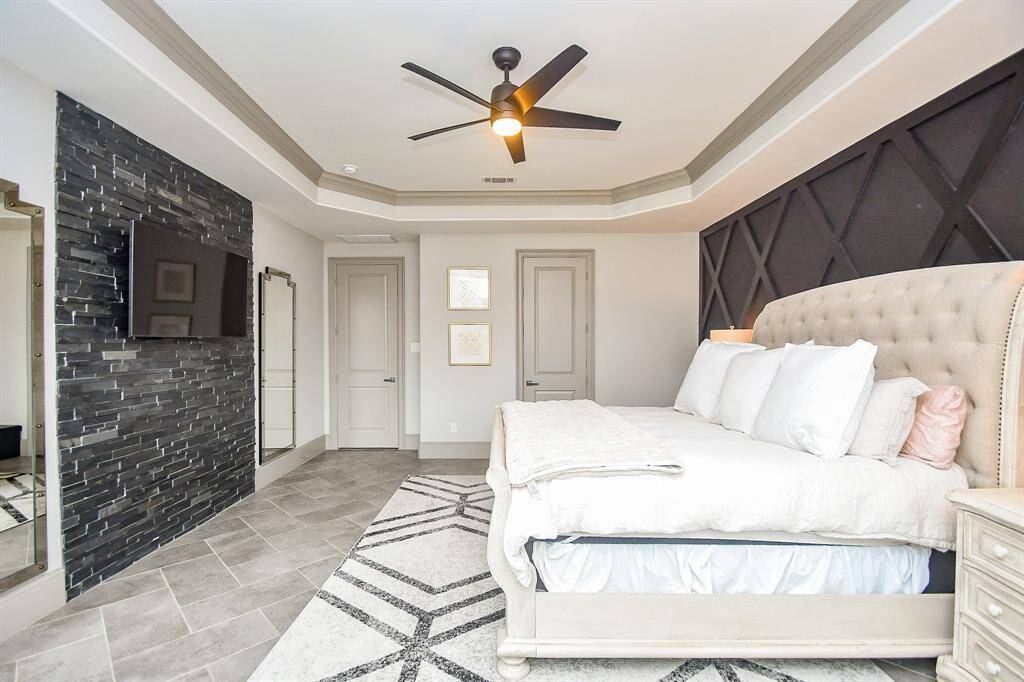 Another view of the master suite with ceiling fans and tile floors!