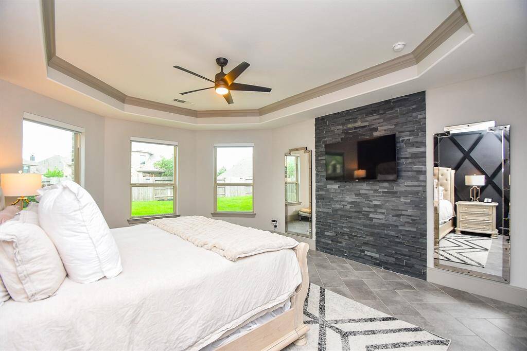 Huge master suite with stone wall and coffered ceiling for your king size furniture!