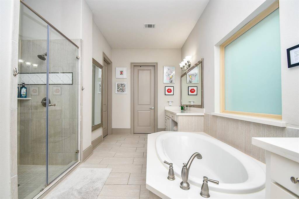 Huge shower with bench! Lovely separate tub!