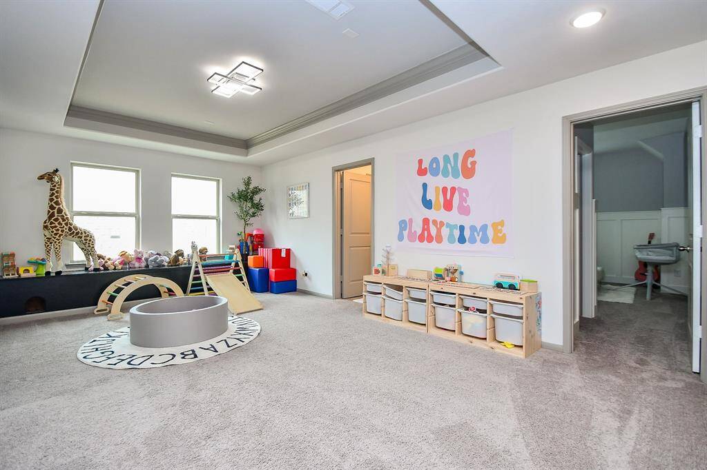 Notice the large gameroom upstairs with natural light and room for all your toys!