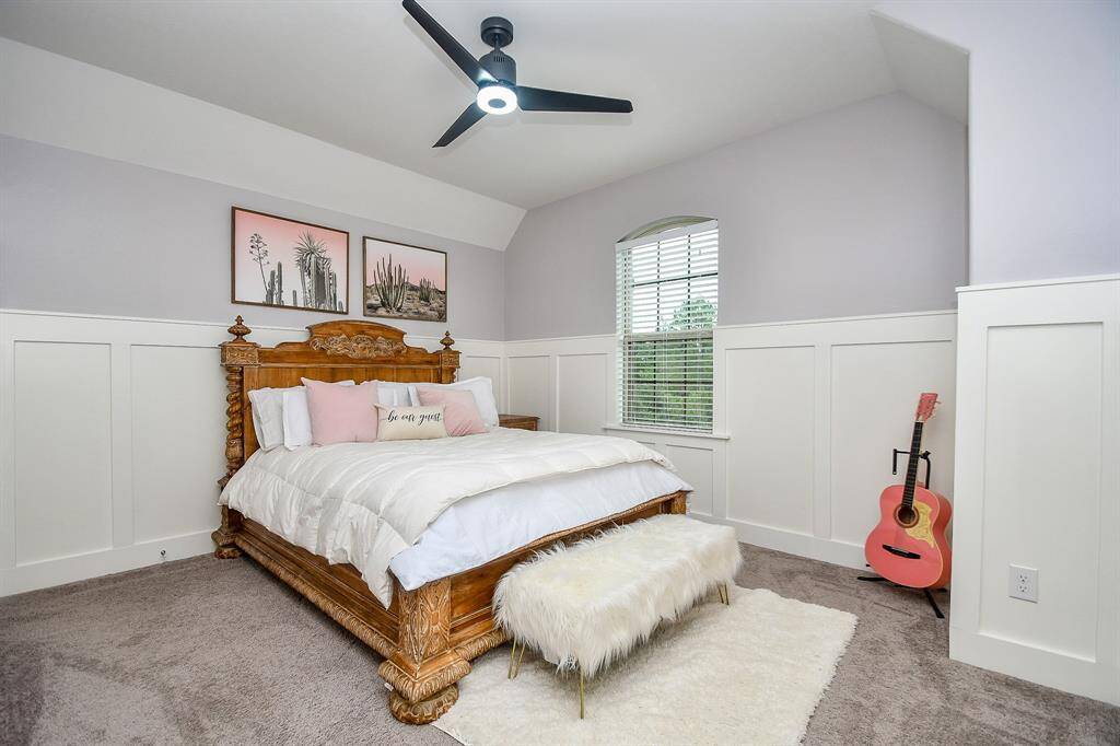 Bedroom 2 with ceiling fan and walk in closet!