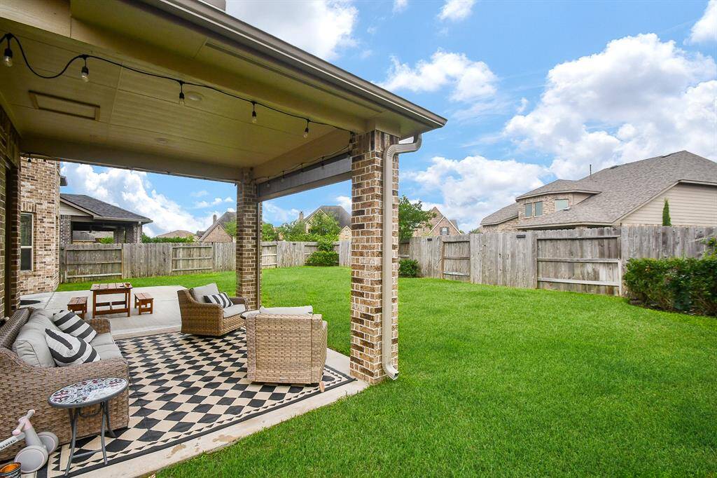Ample room in this large backyard for play, pool and grill outs!