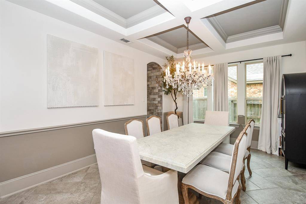 Look at the ceilings in this beautiful dining room!