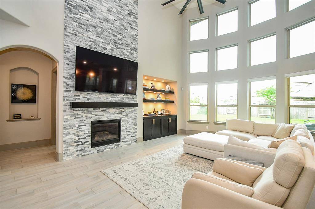 Enjoy the stone wall with fireplace and built in TV!