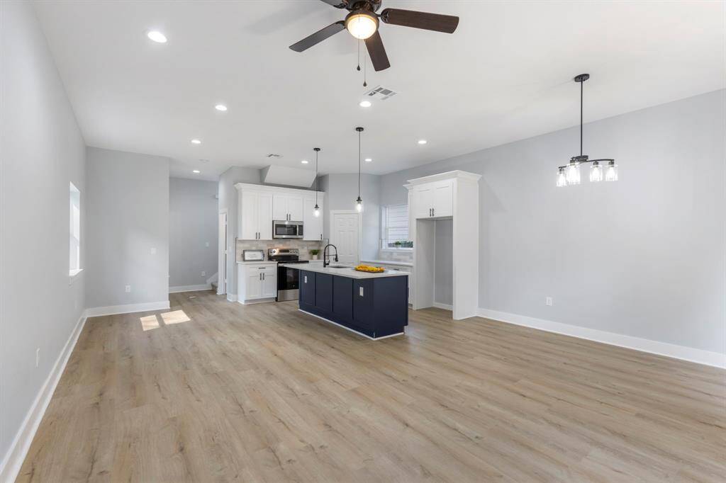 The wide-open concept of the kitchen and dining area gives that relaxing and entertaining vibe! This makes the home feel extra inviting.