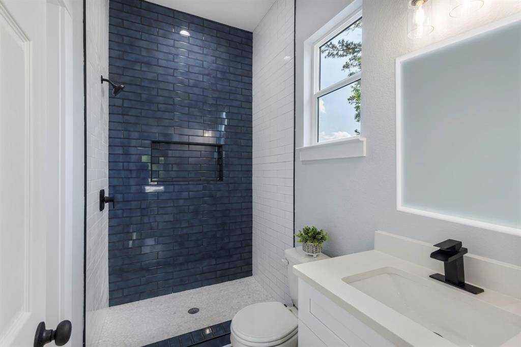 The large standalone shower in the primary bathroom is perfect for relaxing after a long day.