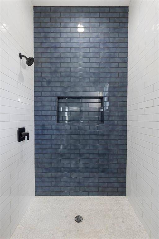 You will fall in love with the gorgeous blue tile in the primary shower. It gives a relaxing coastal vibe!