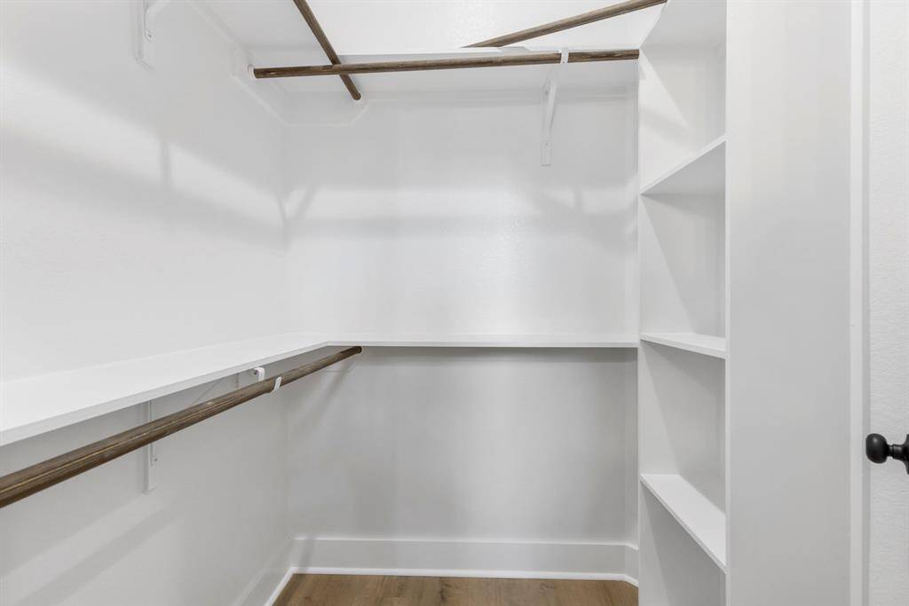 The expansive walk-in closet in the primary bedroom has tons of space for clothes, shoes and extra storage.
