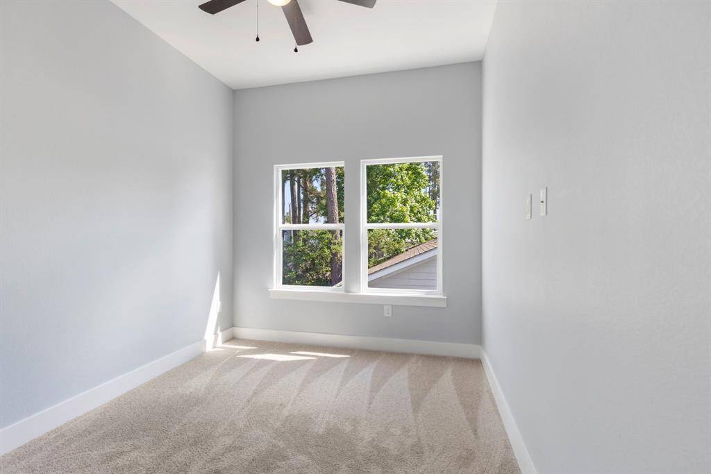 One of two spacious secondary bedrooms. Enjoy the large windows giving the perfect touch of natural light.