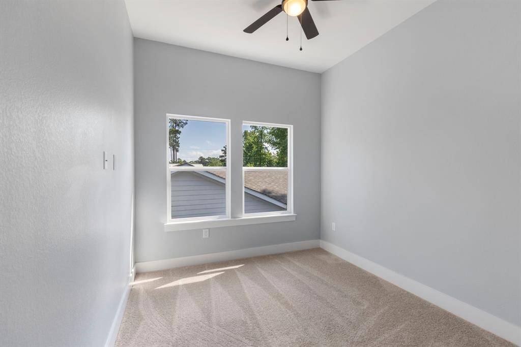 Another secondary bedroom perfect for an extra bedroom, study, workout space, or play room for the kids.