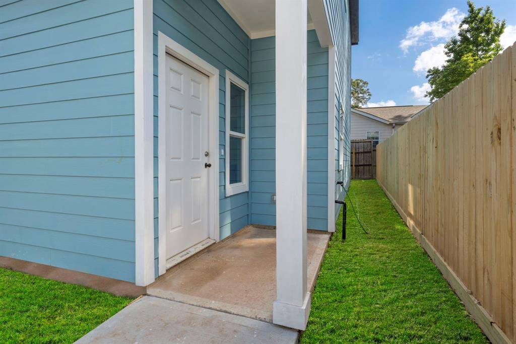 The covered front entrance helps you stay dry on rainy days.