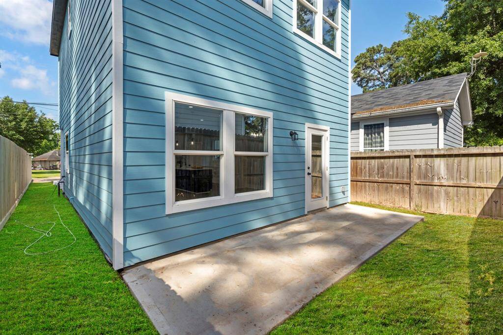 The back patio stretches across the back of the home offering lots of space for a grill and patio furniture.