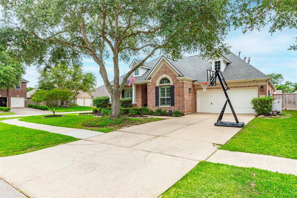 double wife driveway, mature trees, new roof this one has it all