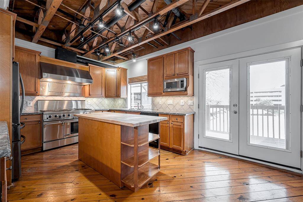 Access to the second floor balcony from the kitchen/breakfast room area.