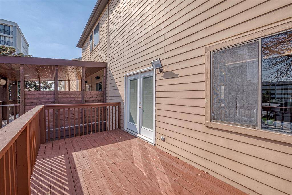 Large upstairs balcony (12X6) for entertaining and grilling.  Notice how the neighbor built a nice cover over their patio which can also be done for this property.