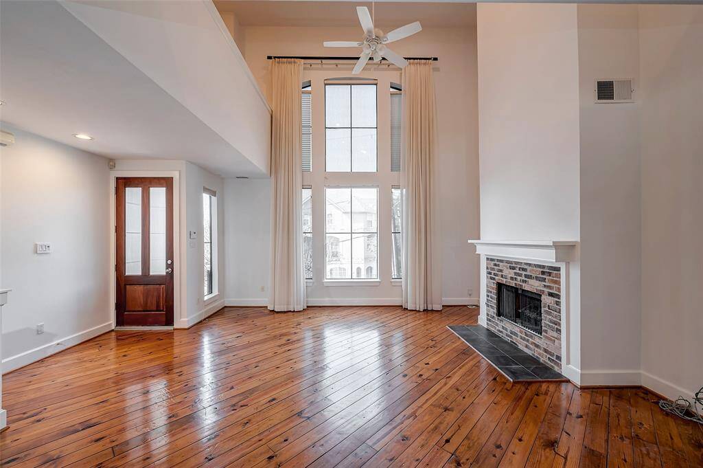 Classic brick elevation with private driveway on a prime street with sidewalks, wider streets and walk to Memorial Dr.