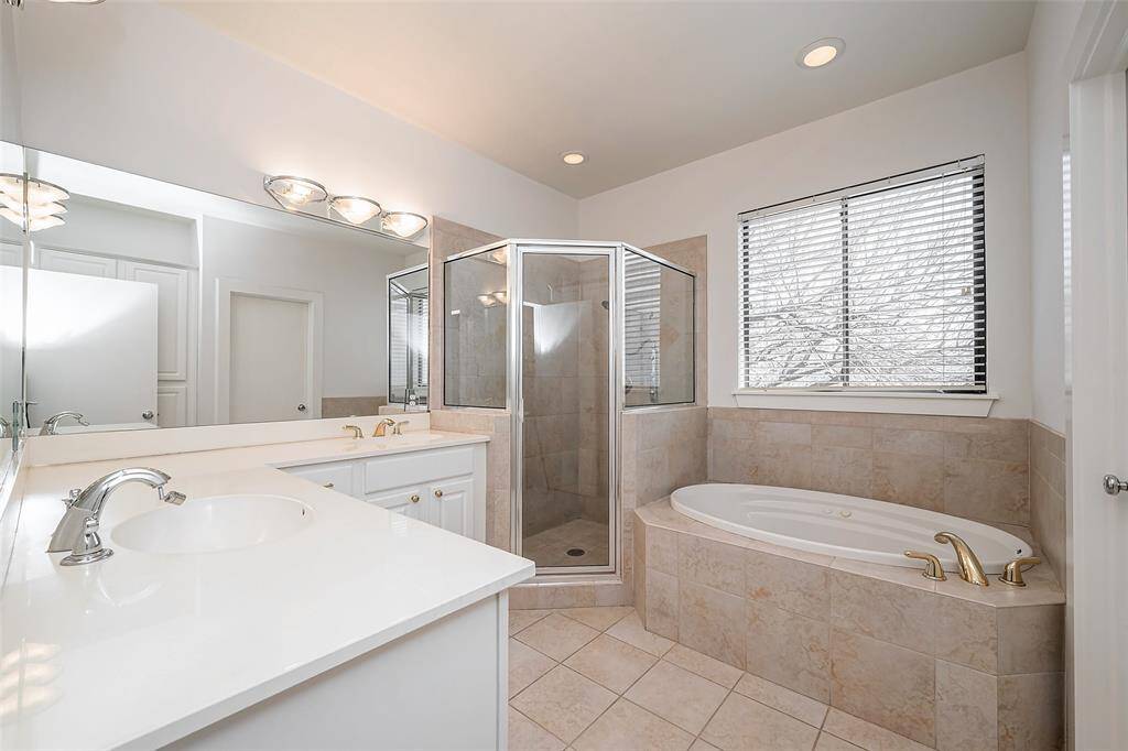 Primary bath with jetted garden tub and separate shower