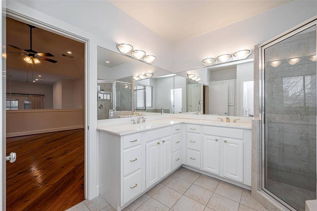 double sinks and tile flooring.