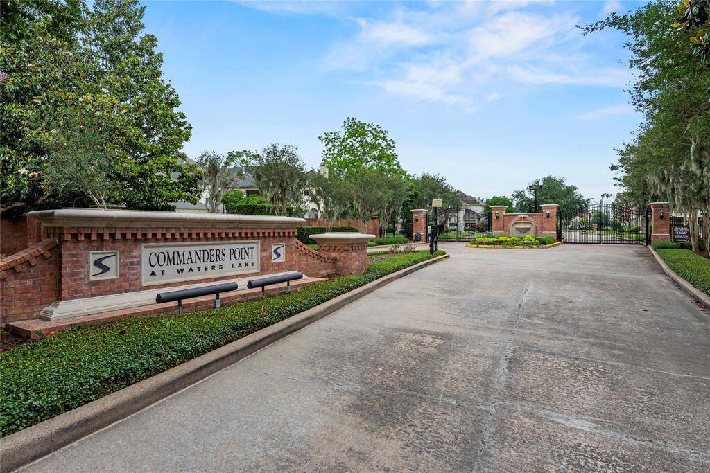 Located in the exclusive gated section of Commander Point, this home offers both privacy and prestige.